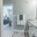 bathroom with sink and large mirror