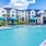 a pool with cabanas